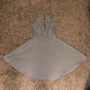 Gray short open/designed back dress with zipper. Lightly used.